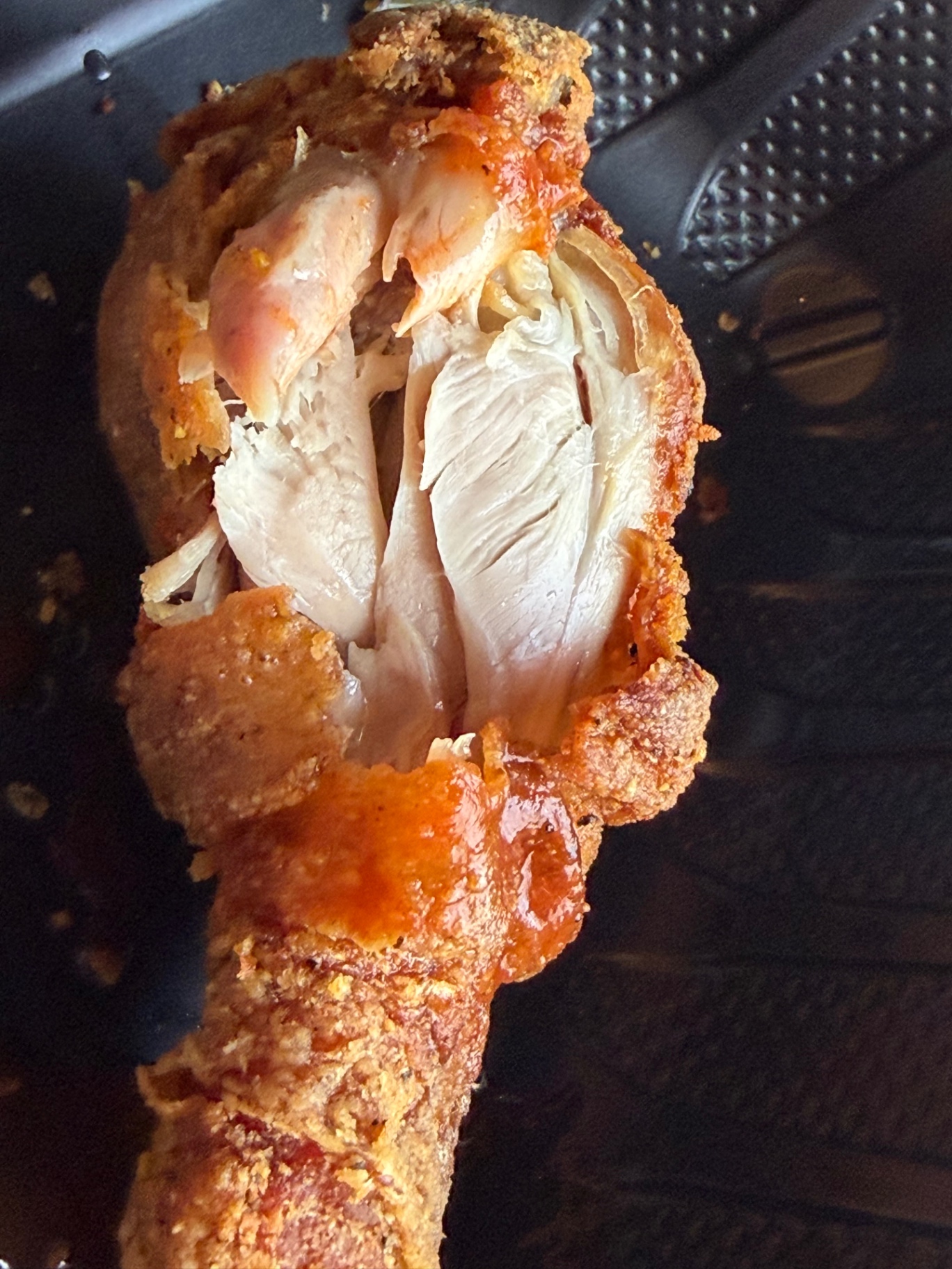 Crispy fried chicken drumstick with juicy white meat